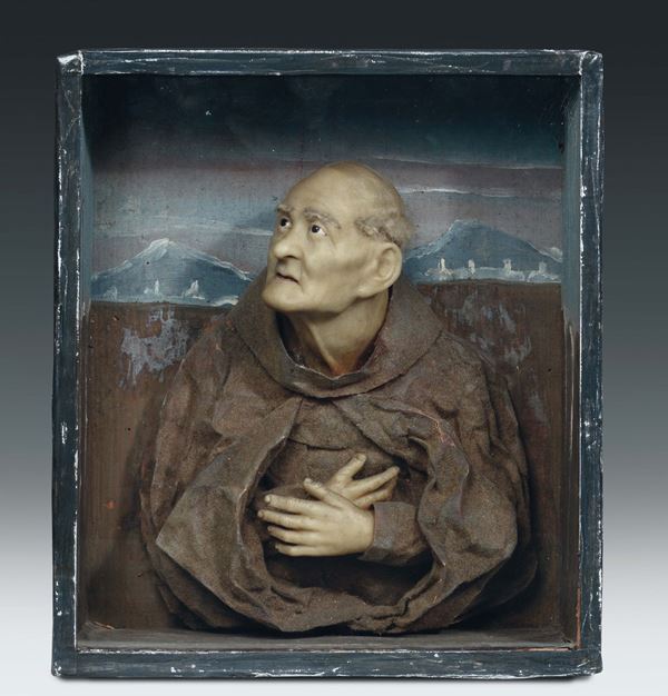A showcase with a wax and paper S. Peter from Alcantara’s bust, Italian or Spanish art, 17th - 18th century