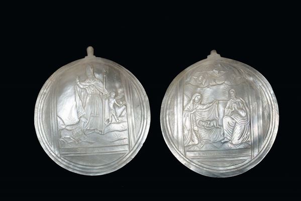 A pair of mother-of-the-pearl plates carved with religious scenes, Italy or the Holy Land, 19th -XX century