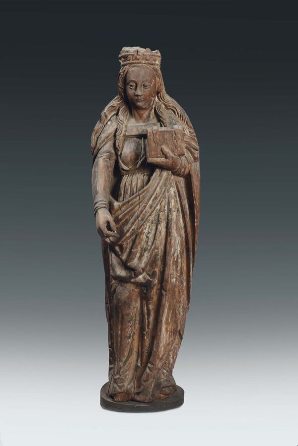 A carved wood saint with book and crown with traces of polychrome, German or Flemish sculptor, probably 15th century