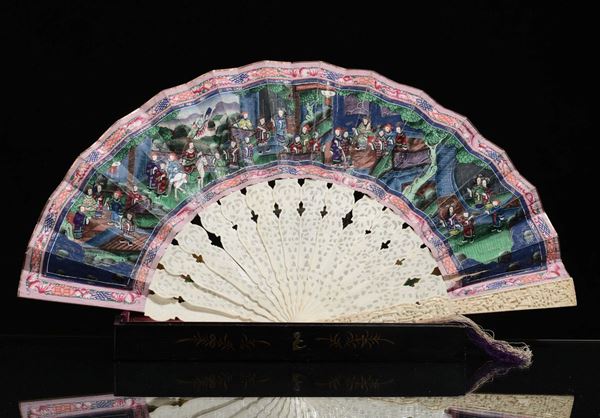 A finely carved ivory fan with wood box painted, China, early 20th century