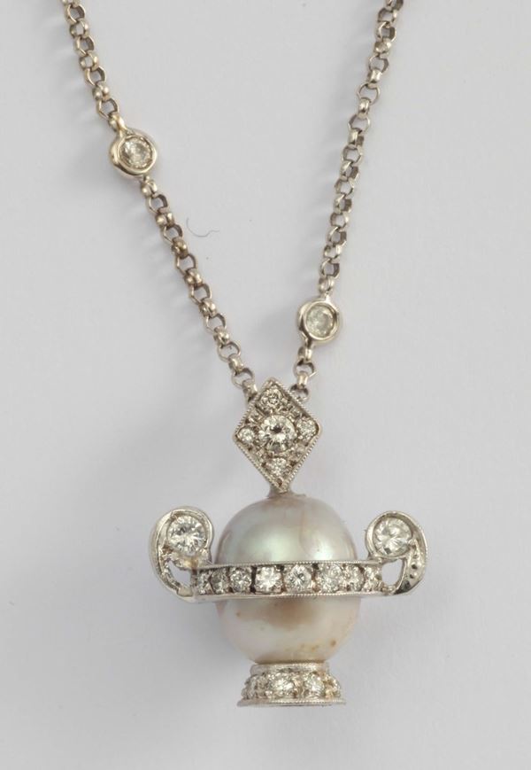 A natural salt water pearl and diamond necklace
