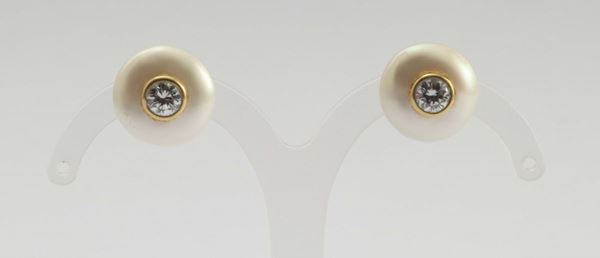Damiani. A pair of pearl and diamond earrings