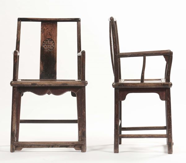 A pair of carved Homu wood armchairs, China, Qing Dynasty, 19th century