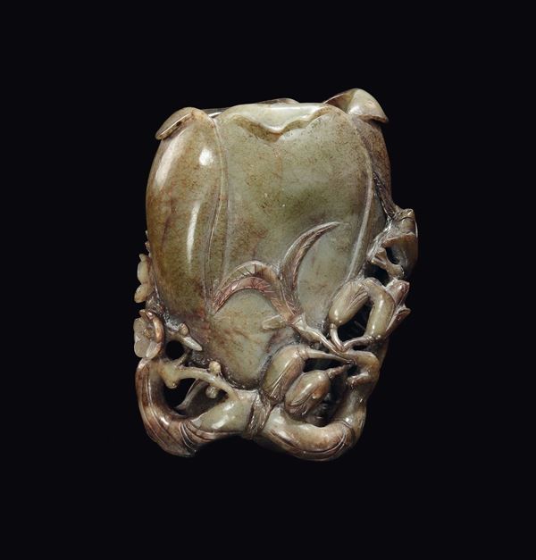 A Celadon jade and russet pumpkin brush holder, China, Qing Dynasty, 19th century
