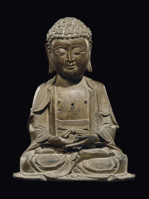 A bronze figure of Sakyamuni with swastika, China, Ming Dynasty, 17th century