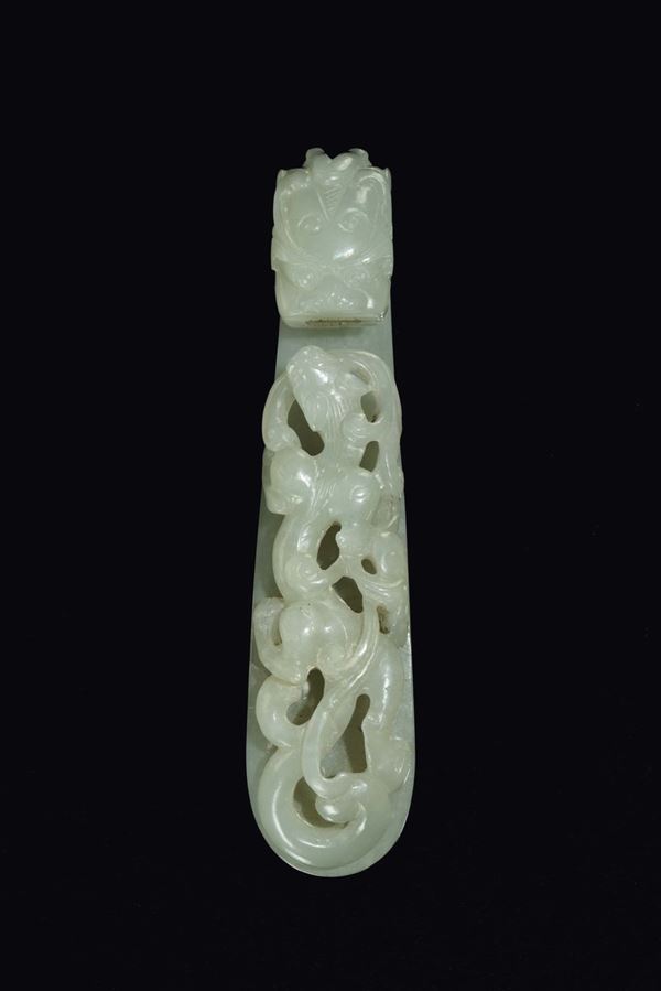 A carved white jade dragon buckle, China, Qing Dynasty, Qianlong period (1736-1796)