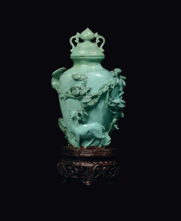 A carved turquoise vase with deer in relief, China, Qing Dynasty, 19th century