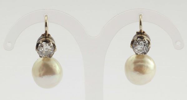 A pair of natural salt water pearl and old cut diamond earring