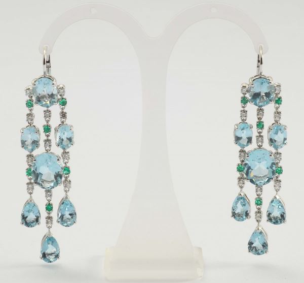 A pair of blue topaz, diamonds and emerald pendent earrings