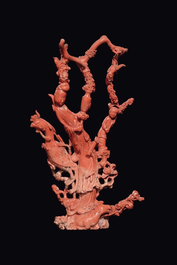 A coral “Guanyin with phoenix and blooming branches” group, China, Qing Dynasty, late 19th century