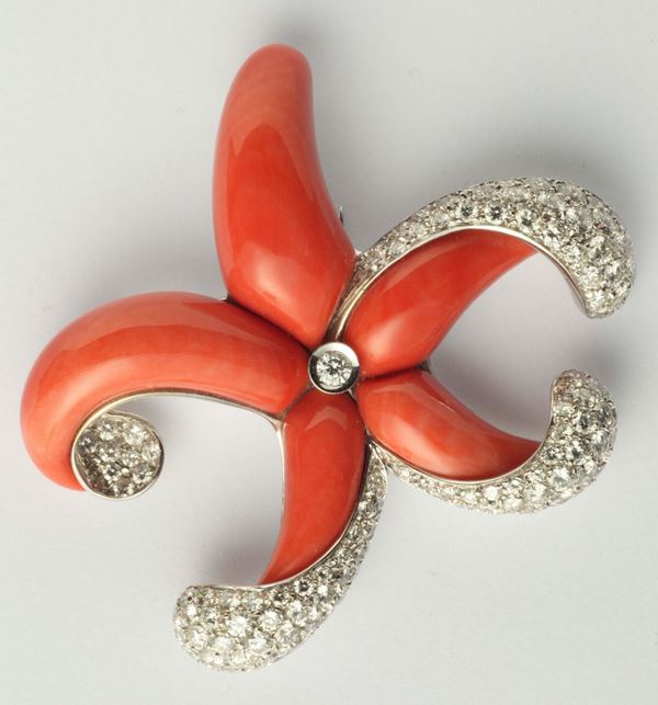 A coral and diamond starfish brooch. Signed and numbered Chantecler. Original box