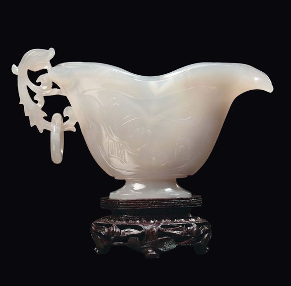 A white agate sauce boat with decorated handle, China, Qing Dynasty, 19th century
