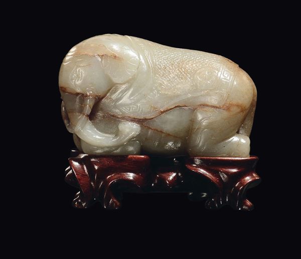 A celadon jade and russet elephant, China, Qing Dynasty, Qianlong period (1736-1796)