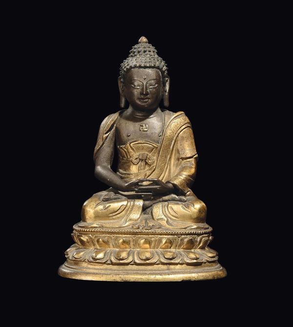 A gilt bronze figure of Sakyamuni, China, Qing Dynasty, Kangxi period (1662-1722)