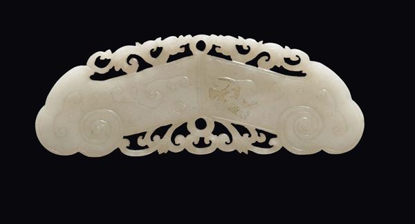 A Celadon jade buckle fretworked with archaic decoration, China, Qing Dynasty, 19th century
