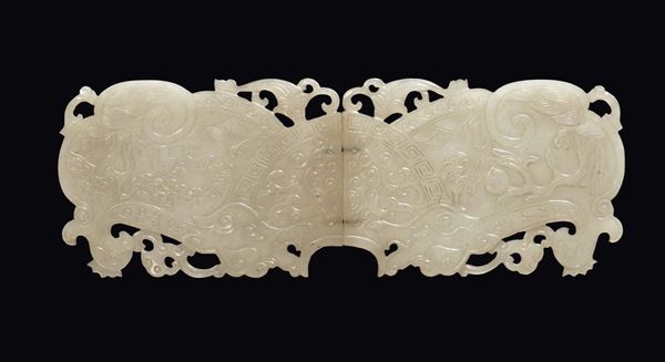 A carved and fretworked white jade buckle, China, Qing Dynasty, 19th century