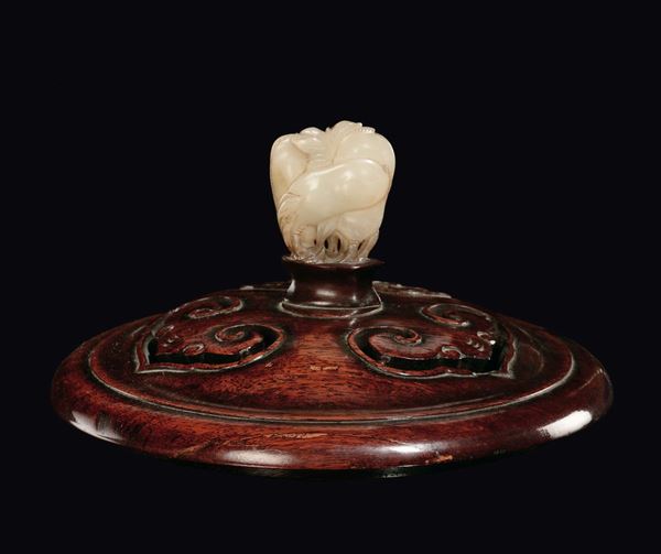 A Huangali wood cover with white jade in the shape of fruit, China, Qing Dynasty, 19th century