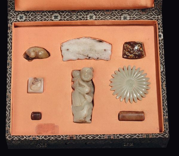 A box with small jade objects, China, from archaic to Qianlong period (960-1796)