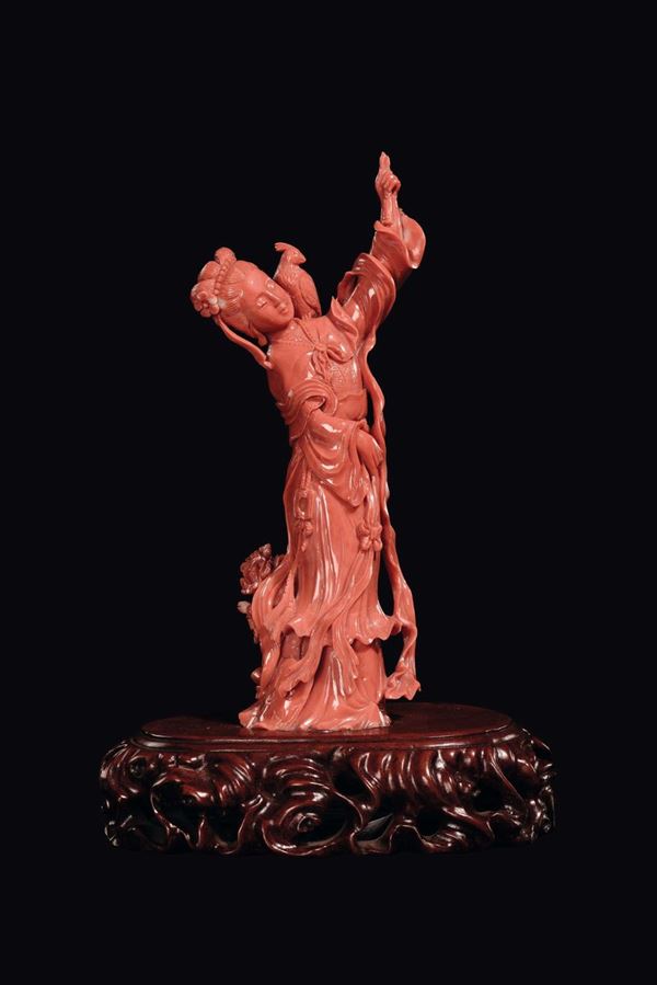A sculpted coral Guanyin with bird, China, Qing Dynasty, late 19th century