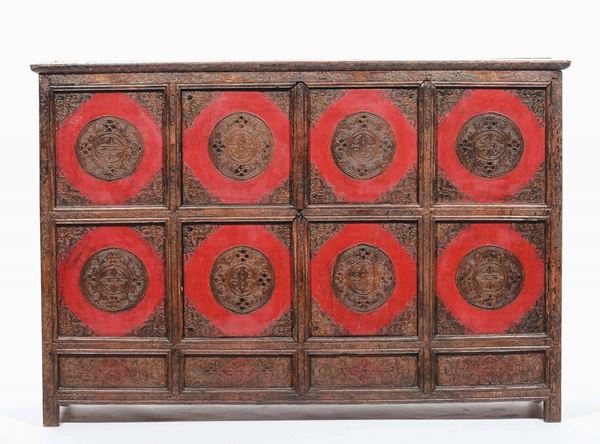 A wooden cabinet with red and gold decorations, Tibet, 19th century