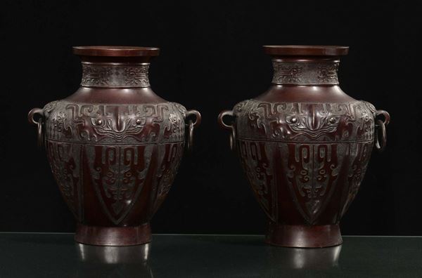 A pair of bronze vases with relief archaic decorations, China, Qing Dynasty, late 18th century
