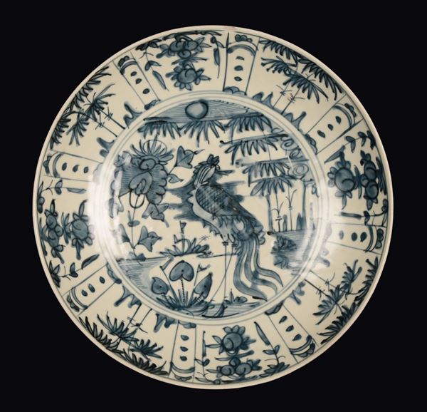 A Swatow blue and white porcelain dish depicting phoenix and landscape, China, Ming Dynasty, 17th century