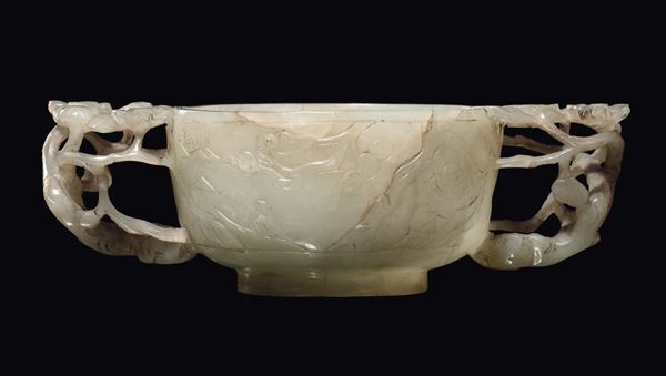 A small carved Celadon jade cup with naturalistic-element handles, China, Qing Dynasty, Qianlong period (1736-1796)
