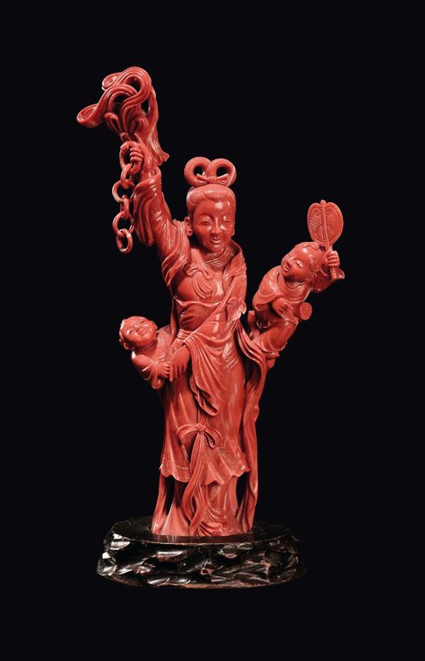 A red coral Guanyin with boys, China, Qing Dynasty, late 19th century