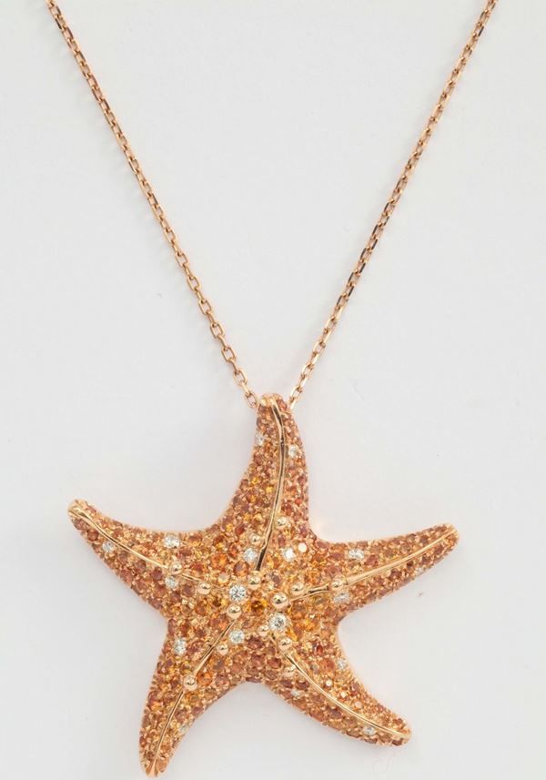 Pendente “stella marina” con zaffiri arancioni e diamanti