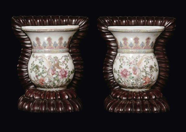 A pair of Famille-Rose porcelain “birds and flowers” wall vases with wooden base, China, Qing Dynasty, 19th century