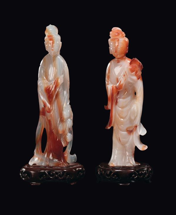 A pair of white and orange agate Guanyin, China, early 20th century