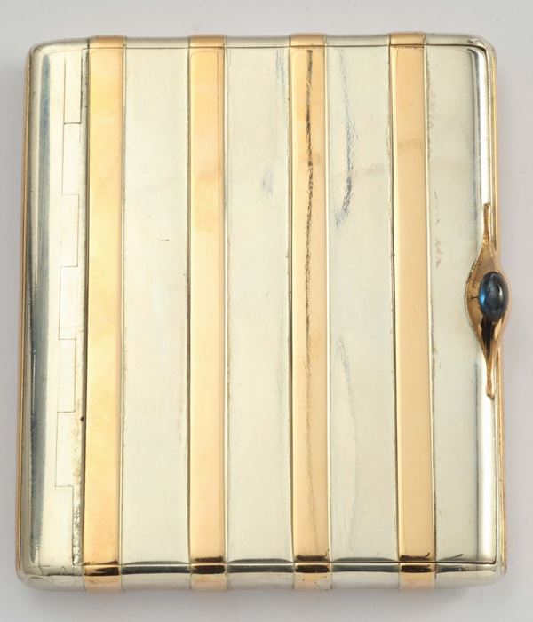 A gold and silver cigarette case