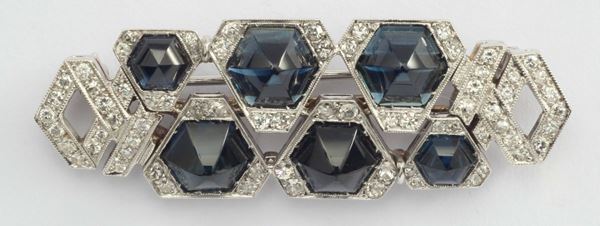 A sapphire, diamond and platinum brooch
