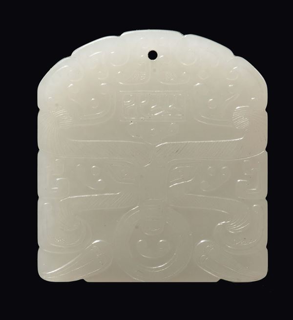 A carved white jade plate with archaic decoration, China, Qing Dynasty, 19th century
