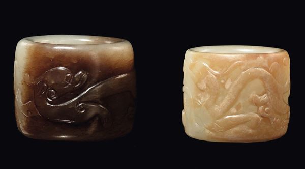 A pair of jade bowmen rings with animals engravings, China, Ming Dynasty, 17th century