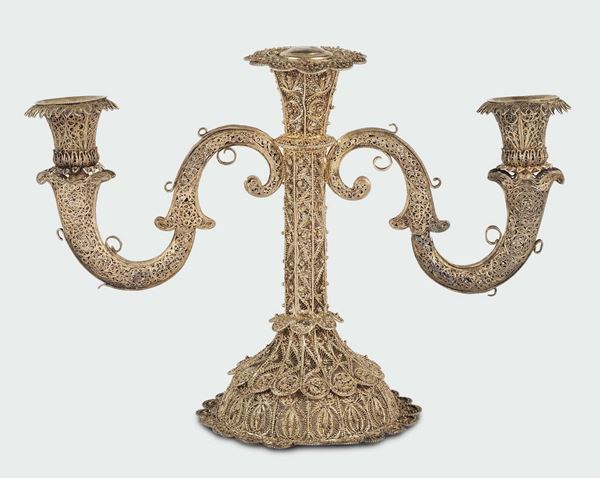 A silver filigree candlestick with three lights, Liguria 19th century