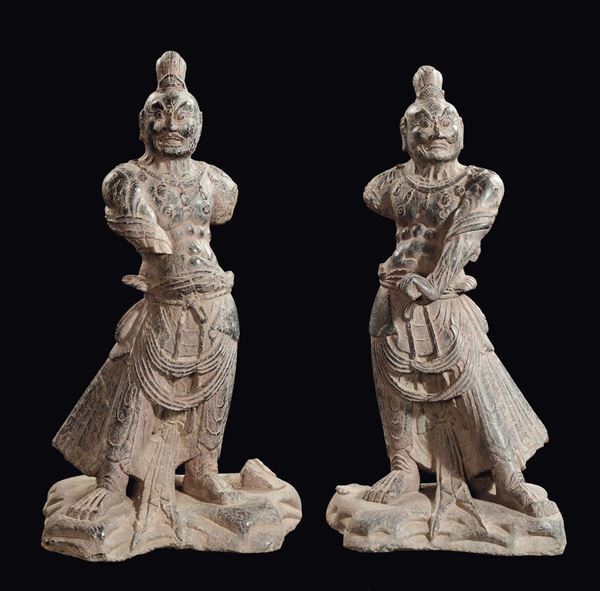 A pair of stone standing dignitaries, China, probably Ming Dynasty, 16th century