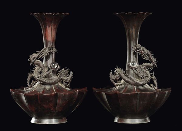 A pair of bronze bottle vases with relief dragons, Japan, 19th century