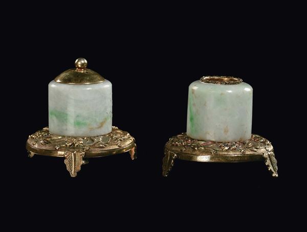 A pair of jadeite bowman rings set with gilt silver, China, early 20th century