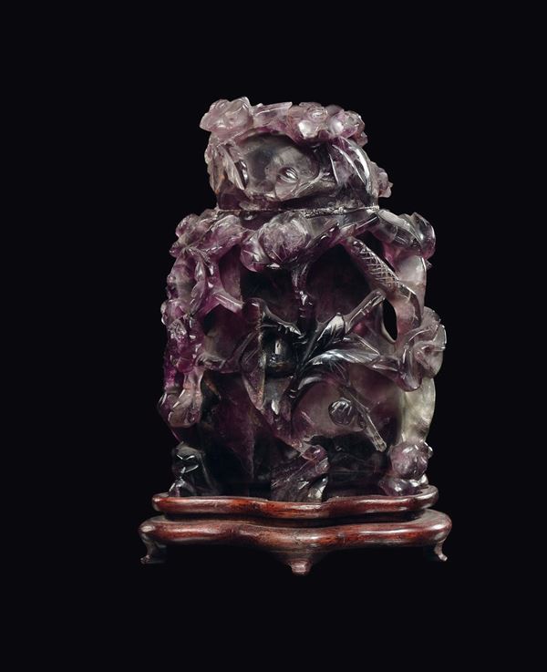 A small amethyst vase with relief blooming branches, China, Qing Dynasty, 19th century