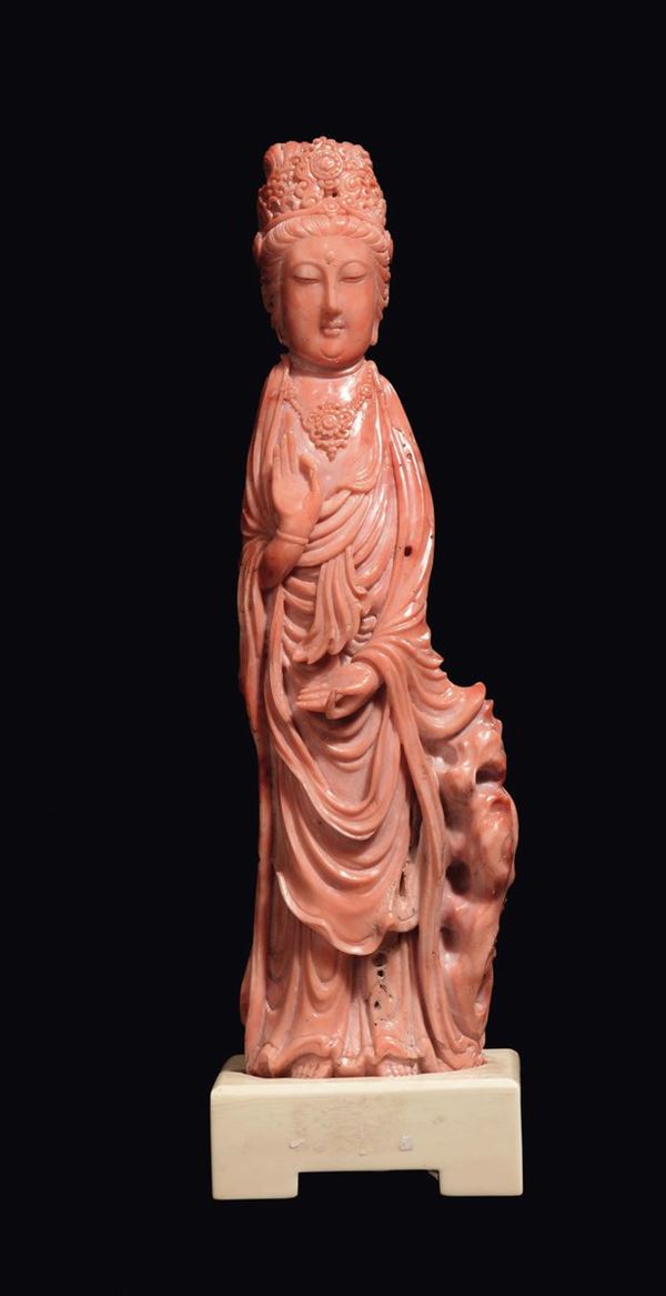 A carved coral Guanyin figure, China, early 20th century