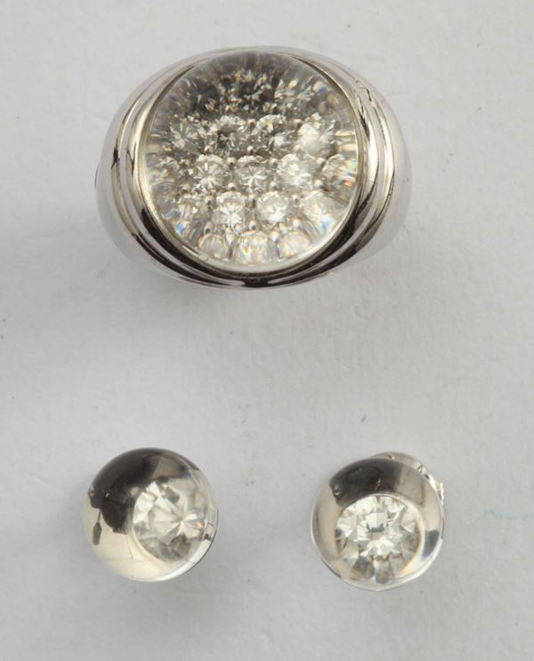 Maubussin, anello ed orecchini con cristallo di rocca e diamanti