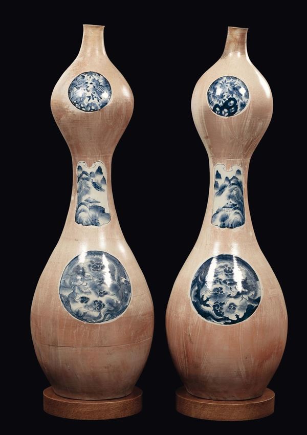 A pair of large double-pumpkin porcelain vases with blue and white reserves with dragons and naturalistic decoration, Japan, 19th century