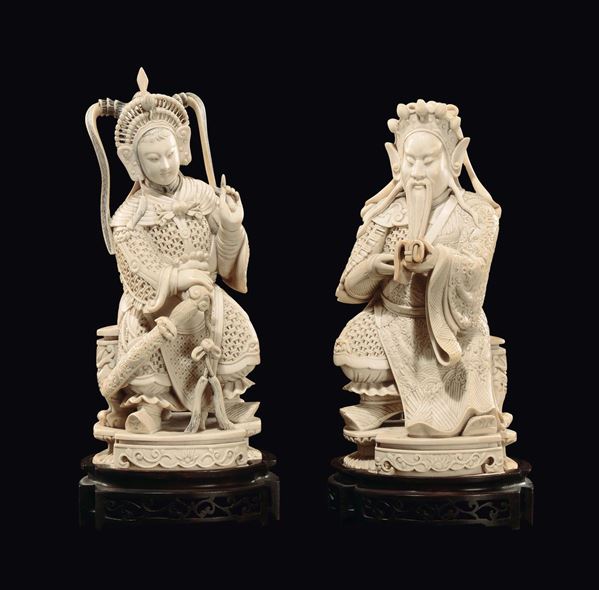 A pair of carved ivory seated emperors, China, Qing Dynasty, 19th century