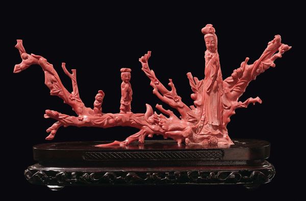 A carved coral branch with Guanyin applied, monkey, squirrels and parrots, China, Qing Dynasty, late 19th century