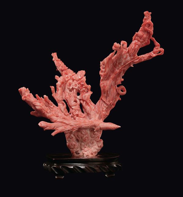 A carved coral with Guanyin, phoenix and peach flowers, China, Qing Dynasty, late 19th century