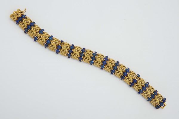 A gold and lapis bracelet. Signed Sforza