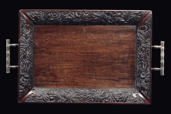 A wooden tray with carved plant motif edge and silver bamboo handles, China, Qing Dynasty, late 19th century