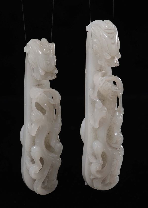 A pair of white jade dragon belthooks, China, Qing Dynasty, Qianlong period (1736-1795)