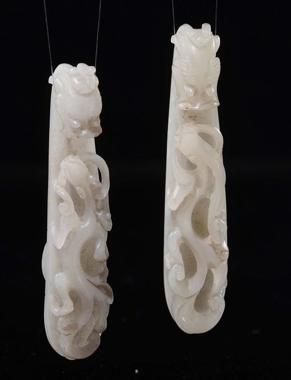 A pair of carved white jade dragon belthooks, China, Qing Dynasty, Qianlong Period (1736-1795)
